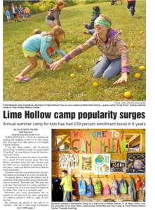 Photos by Bob Ellis/staff photographer  A blindfolded Julia Gustafson attempts to tag Delaney Pace as she collects yellow balls during a game called “Frog Pond” during summer camp at Lime Hollow Nature Center.  Lime 