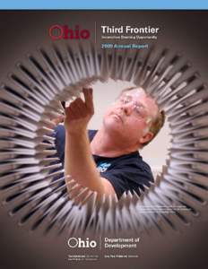 An employee of Siemens is seen through the components of an electric motor at the company’s plant expansion in Norwood, Ohio. Governor Ted Strickland views a small cooling component during a tour of the Catacel Corpor