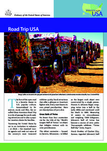 Embassy of the United States of America  Road Trip USA Vintage Cadillac cars decorated with spray paint and buried in the ground form Cadillac Ranch, a colorful roadside attraction in Amarillo, Texas. © lumierefl/Flickr