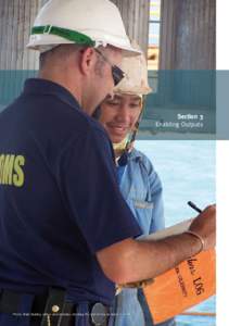 Section  Enabling	Outputs Photo:	Mark	Bentley,	with	a	crew	member,	checking	the	visitors	log	on	board	a	vessel.  Corporate governance