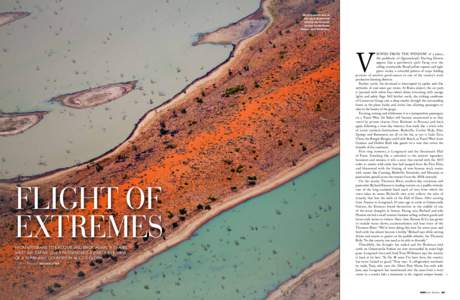 Water borders one of the sand dunes that stretch north-south across the Simpson Desert near Birdsville.