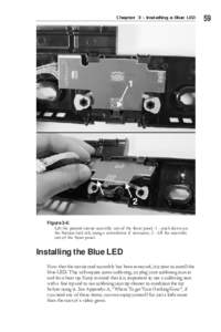 Chapter 3 - Installing a Blue LED  Figure 3-6: Lift the printed circuit assembly out of the front panel. 1 - push down on the friction lock tab, using a screwdriver if necessary; 2 - lift the assembly out of the front pa