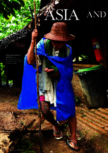 AND  A blind man walks to a work site on an agricultural project run by the NGO Zoa for Mae