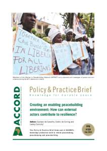 UN Photo/Emmanuel Tobey  Members of the Women in Peacebuilding Network (WIPNET) carry placards with messages of peace and nonviolence during the 2011 elections in Liberia Policy & Practice Brief K n o w l e d g e