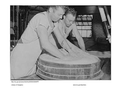 Pressing the curd into form. Swiss cheese factory. Madison, Wisconsin, 1941