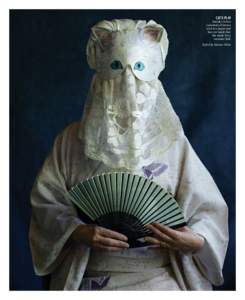 CAT’S PLAY Setsuko in her customary kimono and in a paper and lace cat mask that she made for a