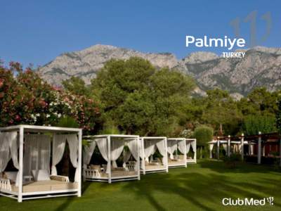 In Turkey, close to Antalya, Palmiye nestles around a vast beach between the wild peaks of the Taurus mountains and the warm, sparkling blue sea. The bungalows sit in the shade of a pine grove and the hotel looks out on