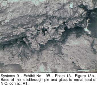 Systems 9 - Exhibit No. 9B - Photo 13. Figure 13b. Base of the feedthrough pin and glass to metal seal of N.O. contact A1. 