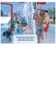 Keeping cool on hot summer afternoons is no sweat for these children as they frolic in the water at the new North Greenwood Recreation and Aquatic Complex. May 2004