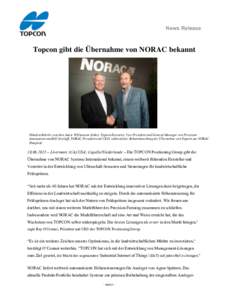 News Release  Topcon gibt die Übernahme von NORAC bekannt Händeschütteln zwischen Jamie Williamson (links), Topcon Executive Vice President und General Manager von Precision Automation und Bill Strelioff, NORAC Presid