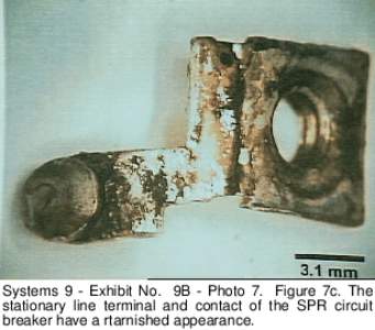 Systems 9 - Exhibit No. 9B - Photo 7. Figure 7c. The stationary line terminal and contact of the SPR circuit breaker have a rtarnished appearance. 