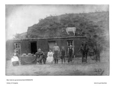 Sylvester Rawding family in front of sod house, north of Sargent, Custer County, Nebraska