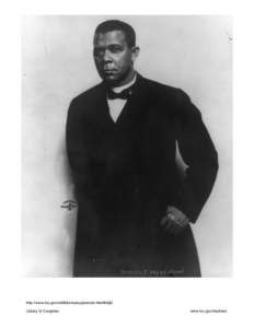 Booker T. Washington, half-length portrait, standing, against white background