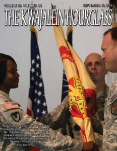 USAG-KA Commander Col. Michael Larsen passes the colors to newly-arrived Command Sgt. Maj. Rawlings. With this action, he delegates authority and entrusts her with the care of the unit and the safekeeping of the colors. 