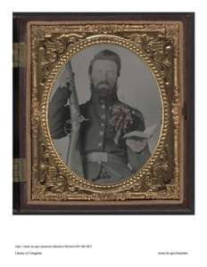 Private David Lowry, of Company E, 25th Virginia Cavalry Regiment, Company A, 41st Virginia Infantry Regiment, and Company D, 47th Virginia Infantry Regiment, in uniform and corsage of flowers with musket and book