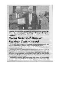 Monmouth County Historical Commissioner Randall Gabrielan (left) presents a spe­ cial recognition award for the establishment of a successful museum to Paul Edelson, President of the Township of Ocean Historical Museum,